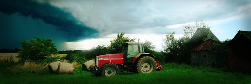 Tractor facing an enormous storm, Bourgogne, France panorama photo